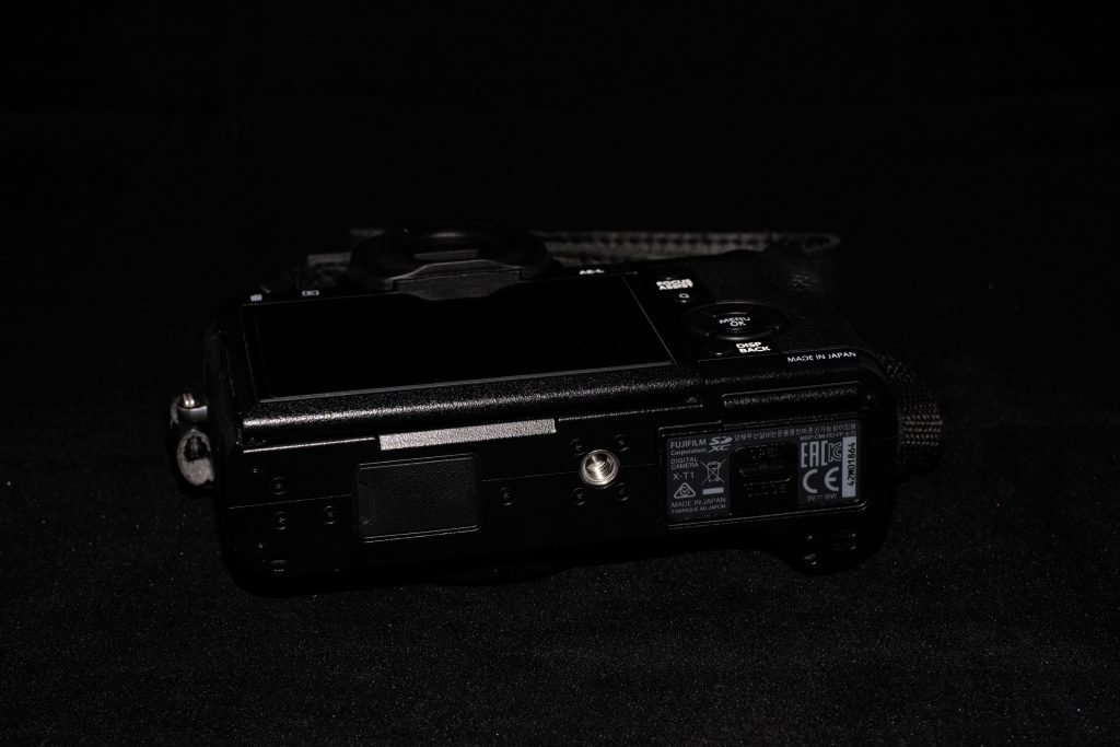 The bottom of the Fujifilm X-T1 camera.